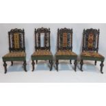 A set of four Victorian oak chairs with bobbin supports and tapestry upholstery, raised on castors