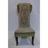 A Victorian prayer chair with tapestry upholstery