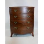 A Georgian style mahogany bow front chest of four drawers, raised on splayed feet, H.76 W.61 D.48cm