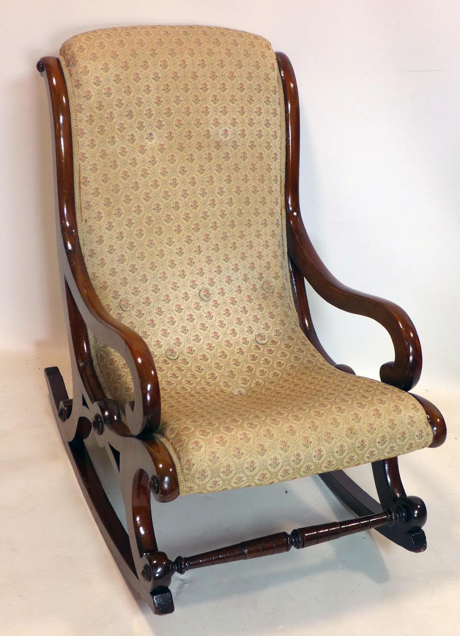 A Victorian mahogany rocking chair