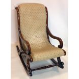 A Victorian mahogany rocking chair