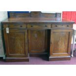 A 19th century Gillows of Lancaster mahogany sideboard, three drawers over three cupboard doors,