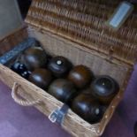 A collection of vintage bowling balls some by Thomas Taylor, together with a set of carpet bowling