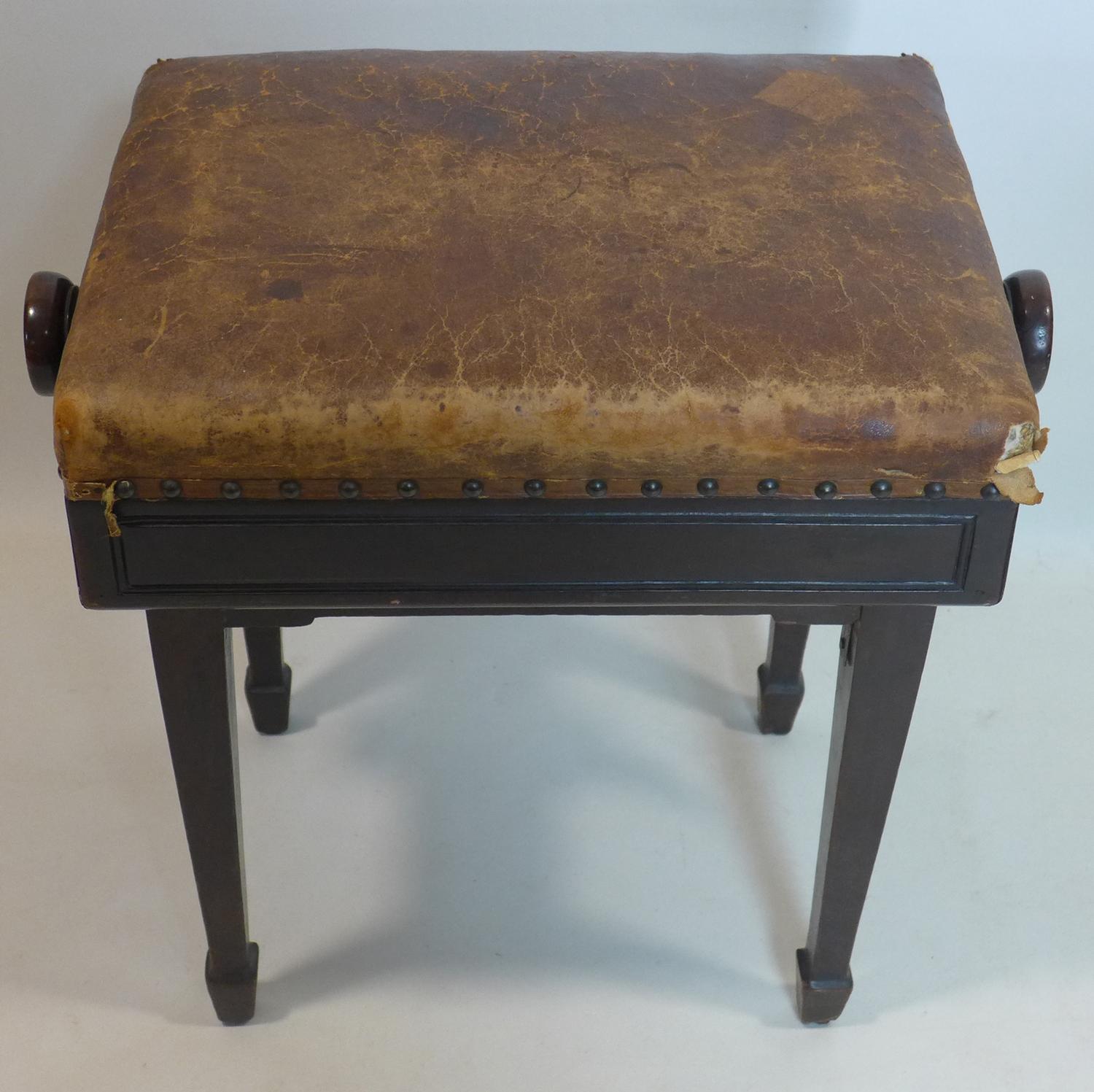 A late 19th century mahogany piano stool, with adjustable leather seat