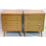 A pair of 20th century light oak side chests raised on splayed legs, H.74 W.60 D.44cm