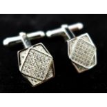 A pair of sterling silver and white sapphire studded panel cufflinks