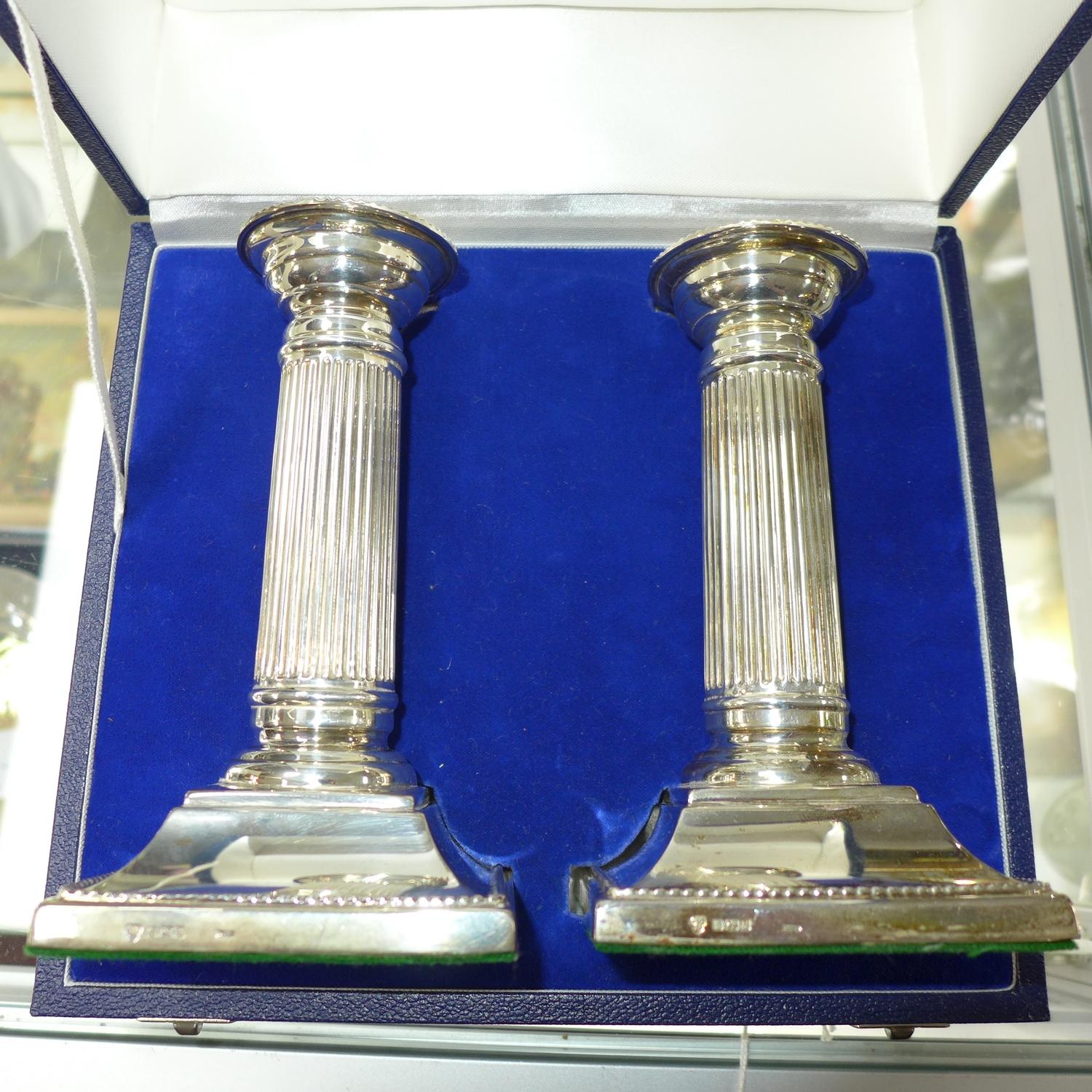 A pair of filled silver Doric column candlesticks, by C J Vander Ltd, Sheffield 1998, H.15cm, in a