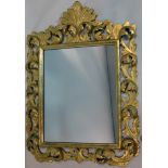 A gilt wood mirror, with pierced scrolling floral design frame and square plate, 83 x 59cm