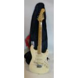 A Jim Harley Stratocaster electric guitar with case