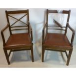 A pair of oak armchairs, one damaged