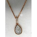 A boxed 18ct rose gold pave diamond-set pendant on an 18ct rose gold chain