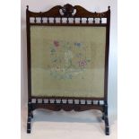 A late 19th century mahogany fire screen with embroidered panel, H.102 W.66 D.28cm
