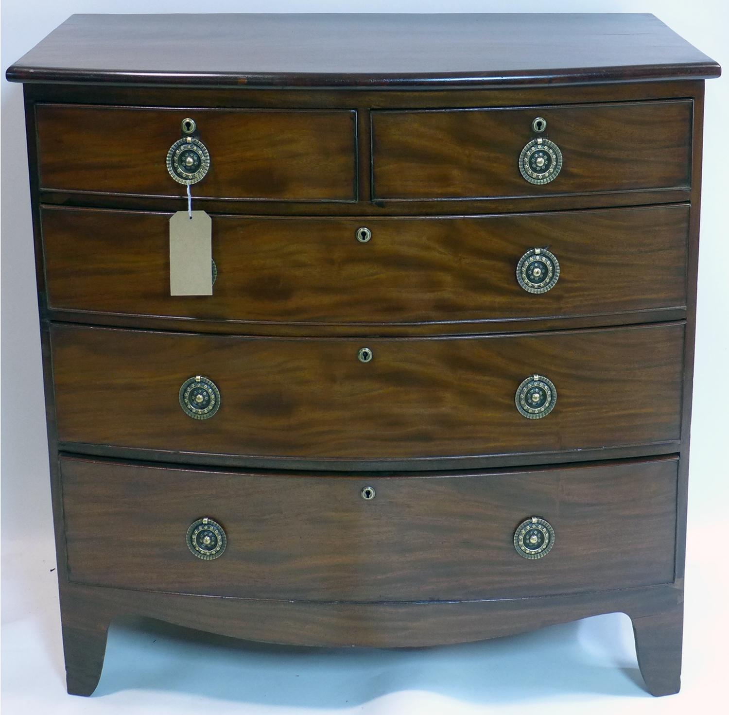 A 19th century mahogany bowfronted chest of two short over three long drawers, raised on bracket