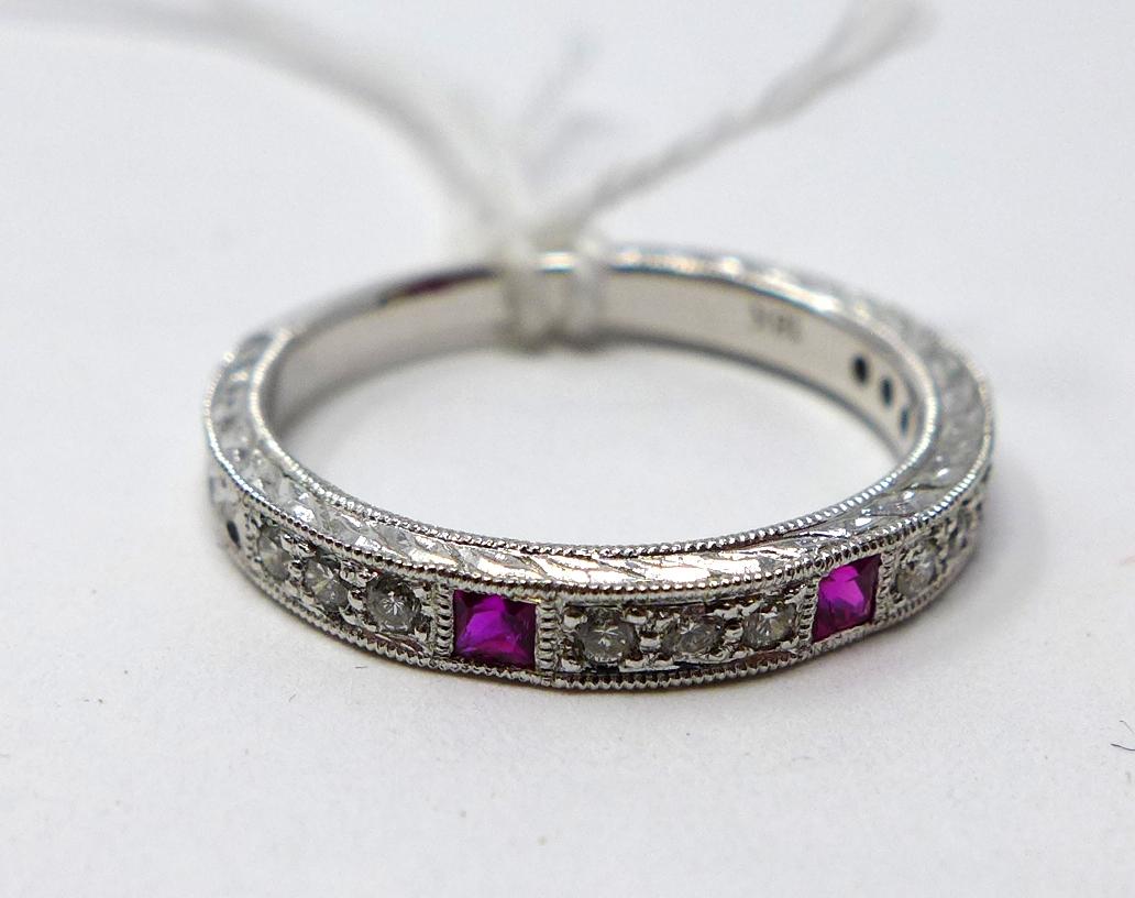 An 18ct white gold diamond and ruby ring, channel set with 3 natural square shaped rubies and 12