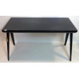 A contemporary ebonized desk, with single drawer flanking two drop down compartments, raised on