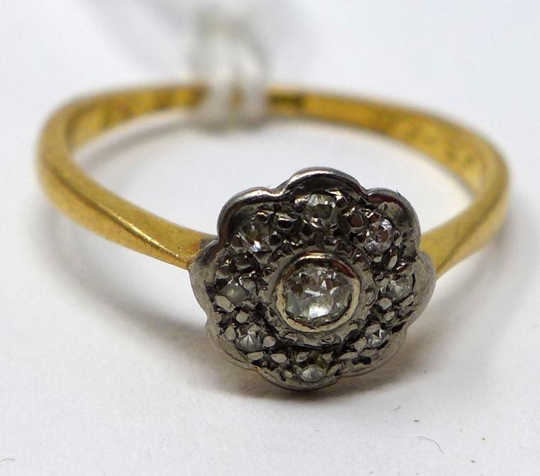 An 18ct yellow gold and platinum diamond flower-head cluster ring, Size: K 1/2, 1.8g