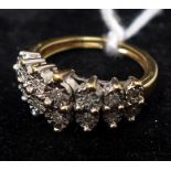 A yellow metal and diamond cluster ring