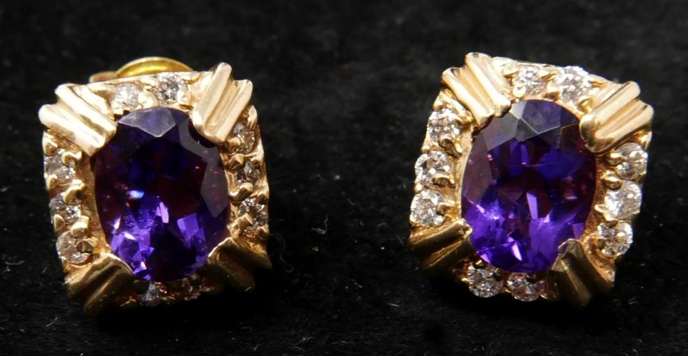 A boxed pair of 14ct yellow gold amethyst and diamond stud earrings