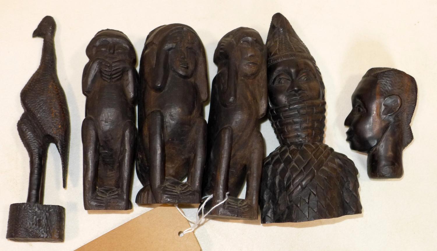 A collection of African tribal ebonised carvings, to include the three wise monkeys, H.17cm (