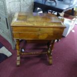 An early 20th century walnut sewing table, H.69 W.54 D.37cm