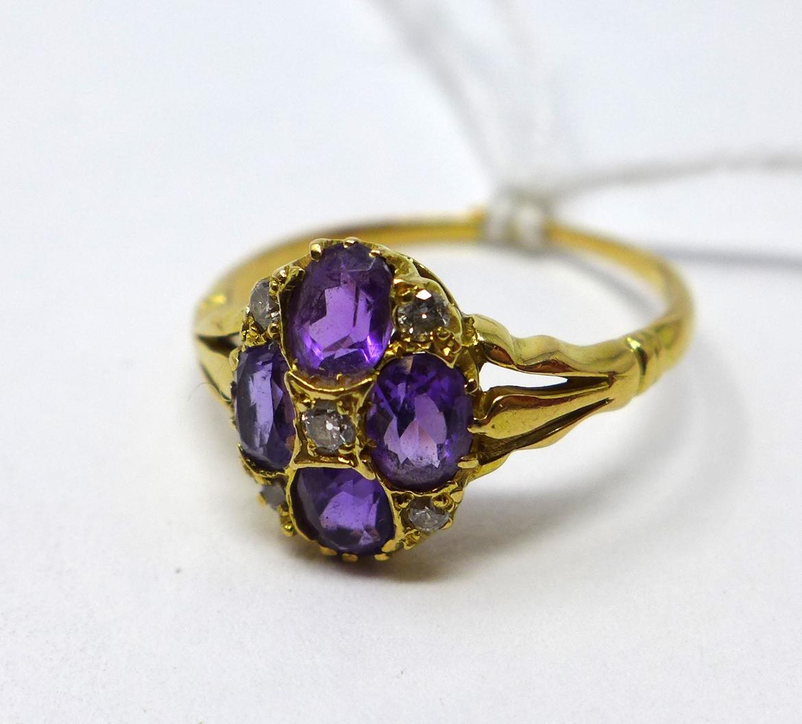 A high carat yellow gold, 19th century amethyst and diamond quatrefoil cluster ring, Size: L 1/2,