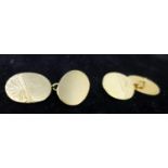 A boxed pair of 9ct yellow gold oval-shaped cufflinks