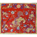A late 19th century Chinese embroidery depicting Dogs of Fo and phoenixes, 73 x 84cm