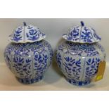 A pair of late 19th/early 20th century Chinese blue & white porcelain pots & covers, H.35cm