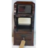 A Victorian mirrored back mahogany wall cabinet with two drawers, H.61 W.28 D.23cm