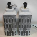 A pair of contemporary Fornasetti style architectural lamp bases, in the form of houses, (no
