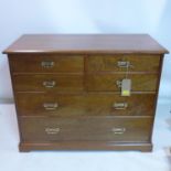 An Art & Crafts walnut chest of five drawers, H.81 W.106 D.52cm