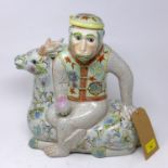 A large early 20th century Chinese porcelain tea pot, in the form of a monkey seated on a deer, H.36