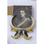 A late 19th century silver and tusk photo frame, 19 x 13cm
