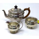A late 19th century silver three piece tea set by E. S. Barnsley & Co Ltd, 22oz