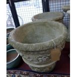 Two reconstituted stone planters, decorated with floral swags and masks, H.50cm Diameter 56cm