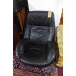 A 20th century Danish black leather reclining swivel chair by Kebe