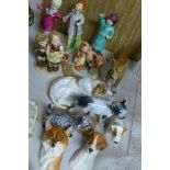 A collection of porcelain dogs to include Royal Doulton and Royal Worcester