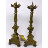 A pair gilt brass pricket candlesticks, knopped stems on tri-form bases, H.33cm (2)