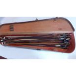 A collection of 23 vintage violin bows in vintage violin case