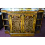 A floral painted satin wood credenza with caned doors, H.83 W.123 D.36cm