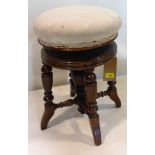 A Victorian mahogany adjustable piano stool