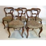 A set of five Victorian rosewood dining chairs with cabriole legs