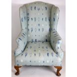 A 19th century wing back armchair, recently upholstered