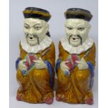 A pair of Victorian glazed ceramic jugs in the form of a seated Chinese figure, H.31cm