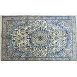 A Central Persian part silk Nain rug, central floral medallion with repeating petal motifs on an