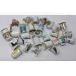 A collection of thimbles, decorated with various scenes, figures and animals (qty)