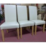 A set of six contemporary faux leather dining chairs