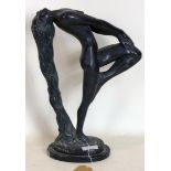 A cast plaster figure of a nude lady with head thrown back and hair draping to the floor, the