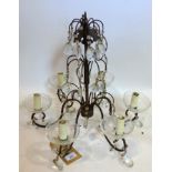 A wrought iron and glass chandelier