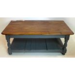 A pine coffee table with painted base, H.45 W.121 D.74cm